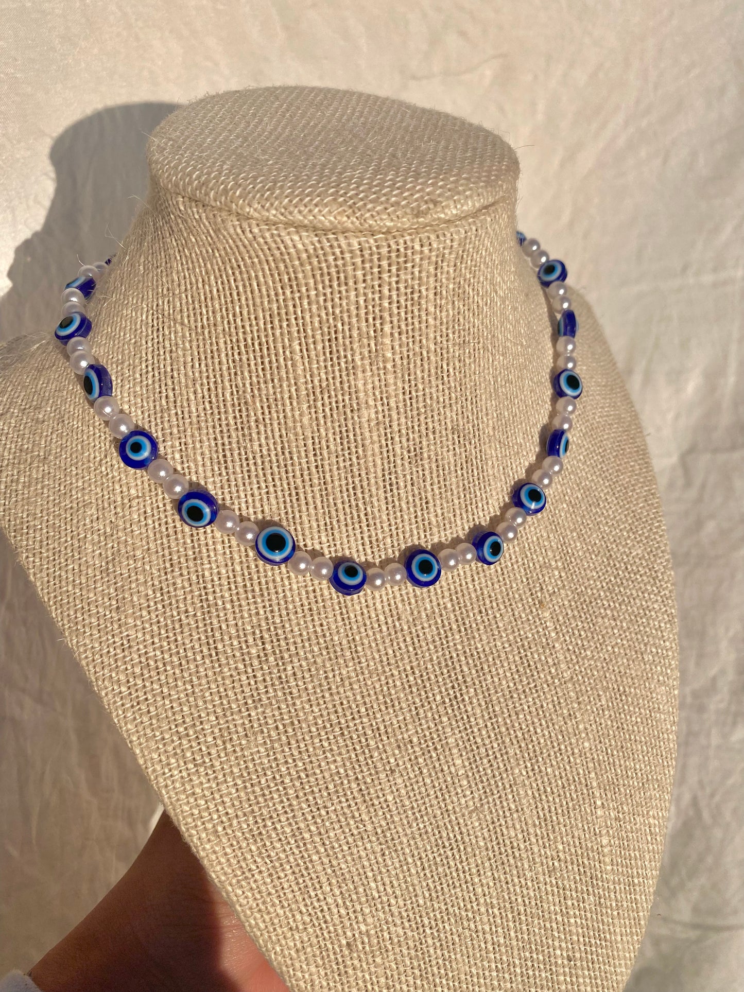 Evil eye pearl necklace